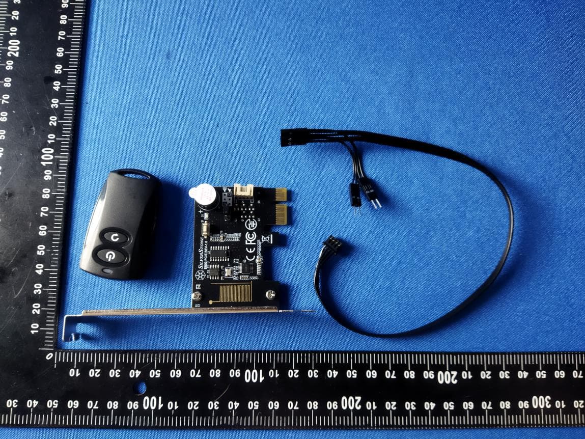 2.4GHz wireless computer power and reset remote switch - FCC ID 2AJUN-ES02PCIE - SilverStone Technology Co., Ltd