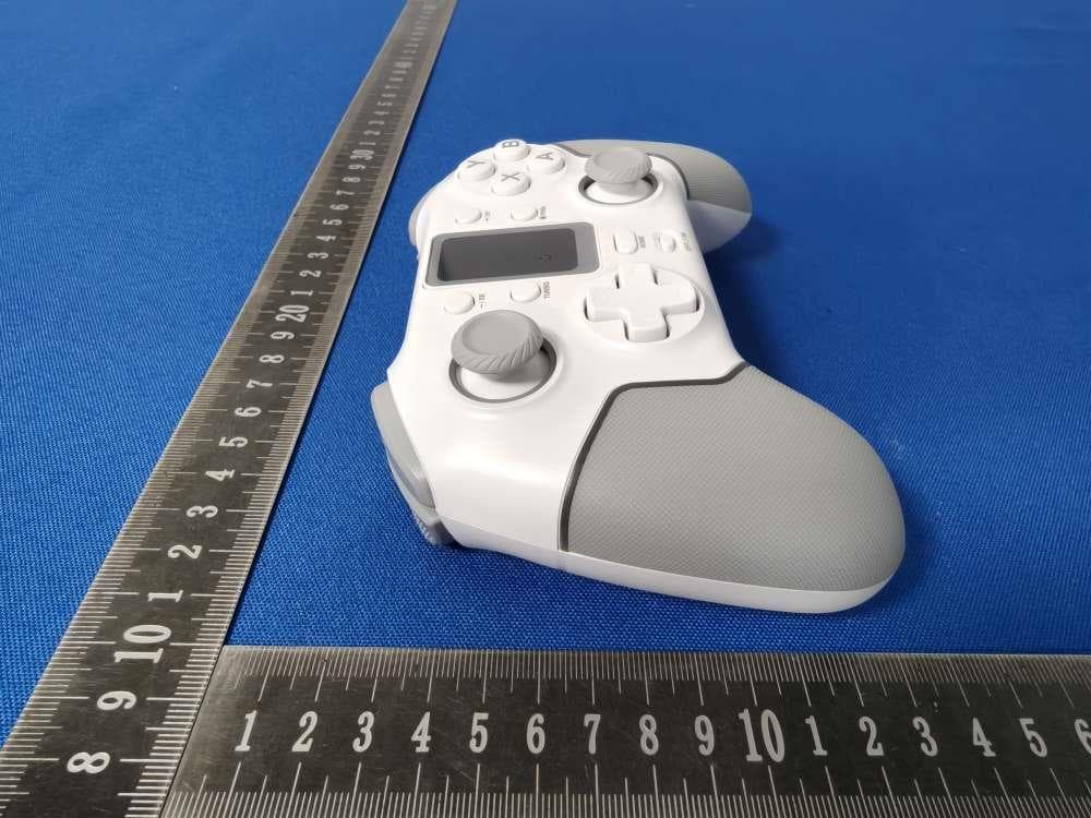 Multi-Function Game Controller - FCC ID 2ATI7STK-7052PD - SHENZHEN SAITAKE ELECTRONIC CO.,LTD. (2)