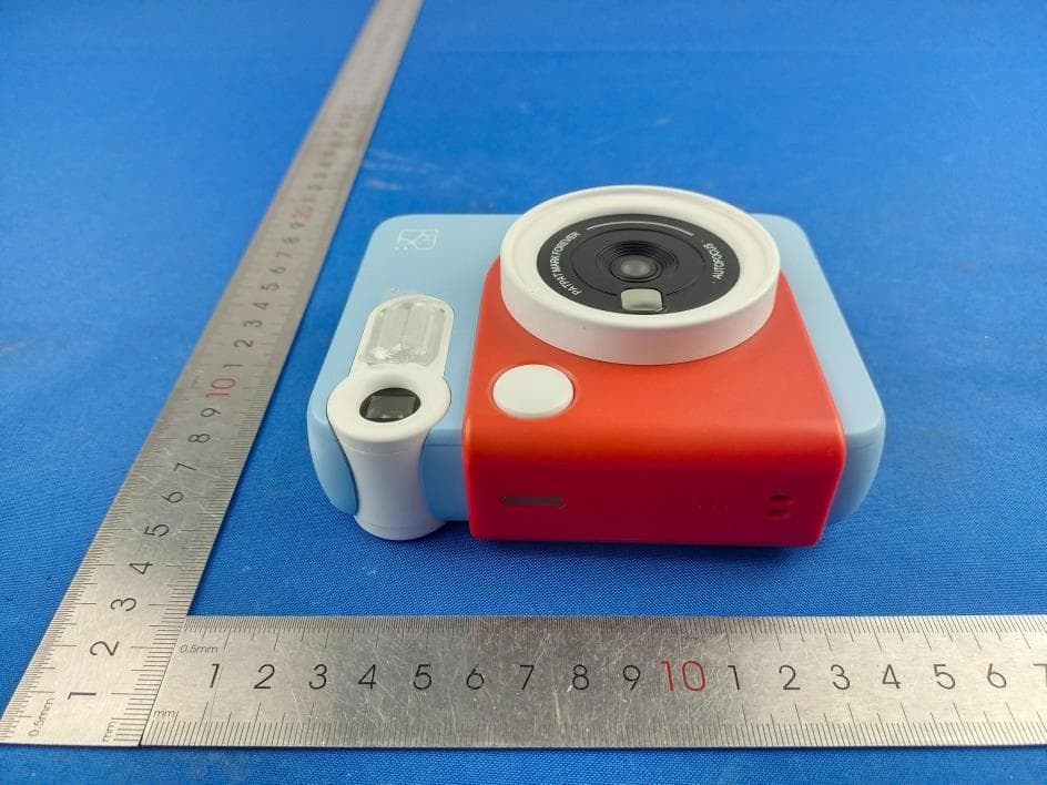 Portable Photo Printer, INSTANT CAMERA - FCC ID 2AUTE-2TS25G - Xiamen Hanin Co.,Ltd.