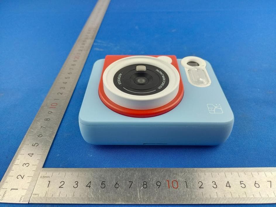 Portable Photo Printer, INSTANT CAMERA - FCC ID 2AUTE-2TS25G - Xiamen Hanin Co.,Ltd. (2)