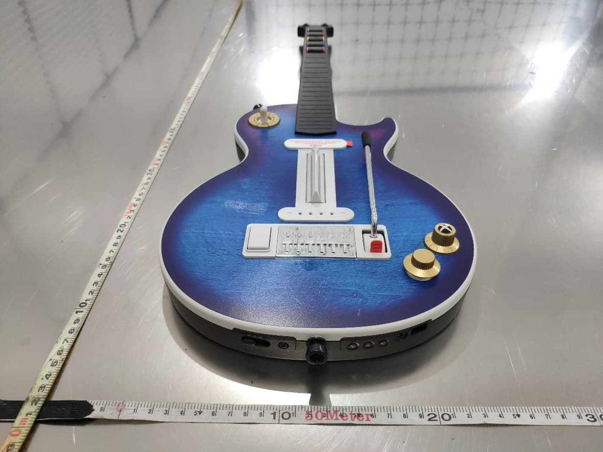 Guitar controller - FCC ID 2BAXLCK25GX - Freemode Go LLC dba CRKD