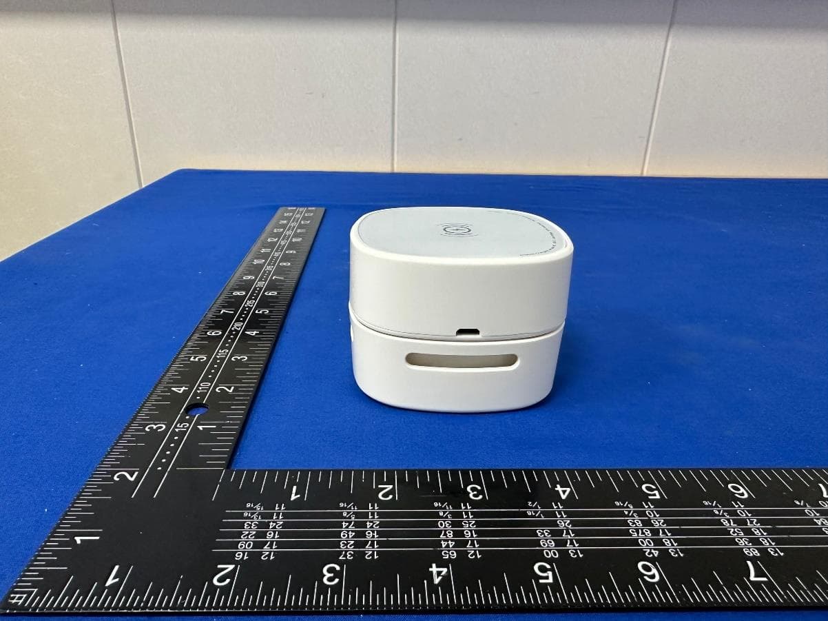 Desktop vacuum cleaner with wireless charging - FCC ID 2BHV7LP-066X - Ningbo Henglang Import and Export Co., Ltd (5)
