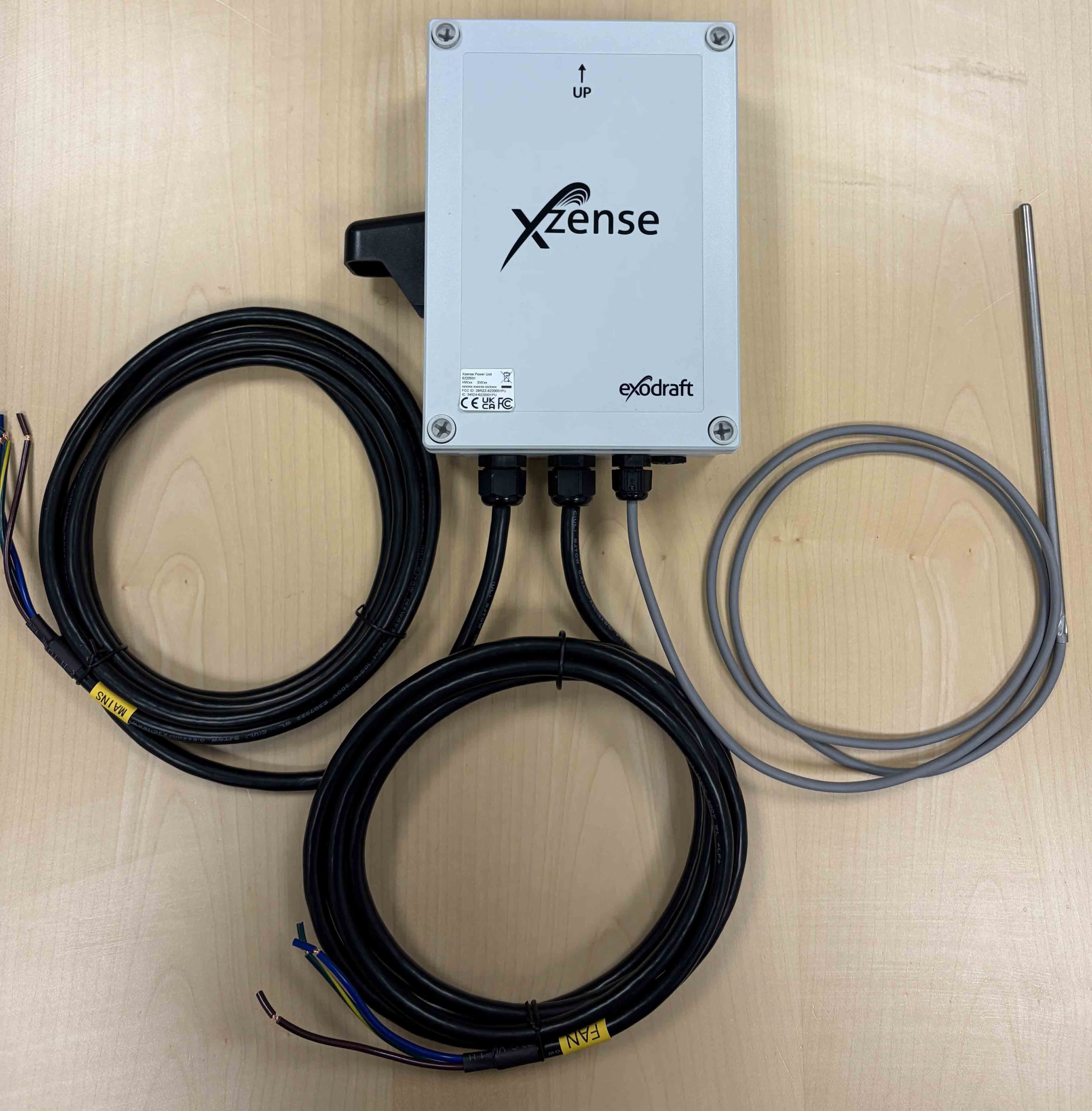 The product is the Xzense Power Unit, which receives control commands wirelessly from an associated Xzense Display Unit, either directly or via the Xzense Repeater, and regulates the chimney fan for fireplaces, stoves, and solid fuel boilers accordingly - FCC ID 2BRZZ-6220001PU - Exodraft A/S (3)