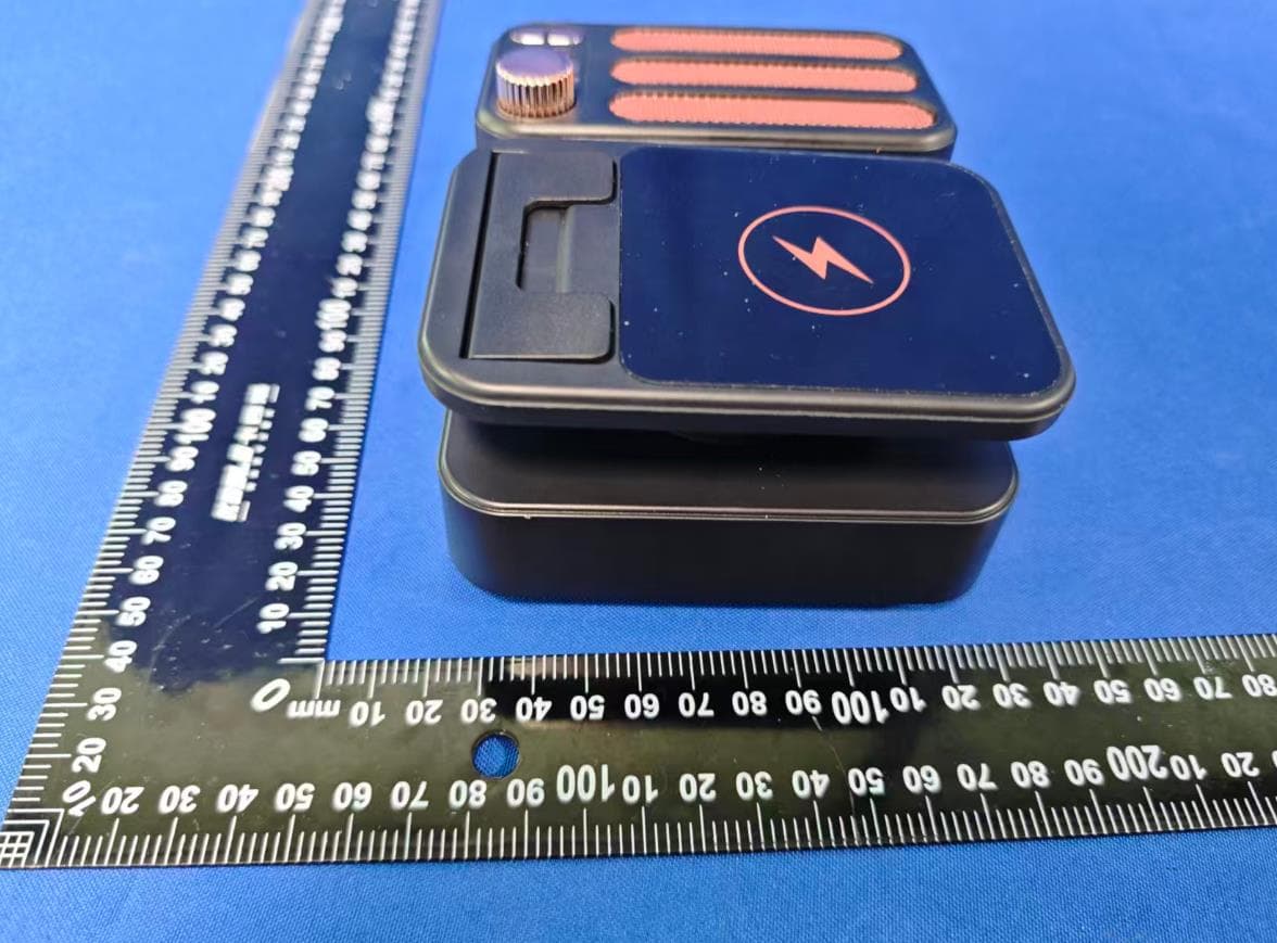 A phone stand with wireless charging - FCC ID 2BTJK-F115 - Dongguan City JuPinMeisheng Electronic Technology Co., Ltd.