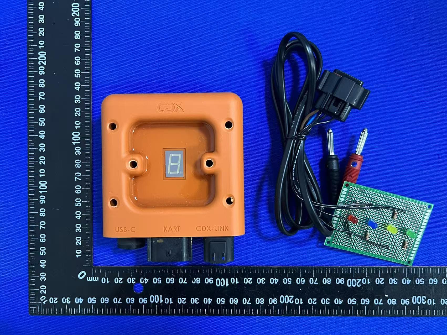 The CDX EV Controller is an electronic control unit designed to manage and limit the maximum speed of an alectric go-kart. - FCC ID 2BUQO-CDX-EVRC2301 - CDX Technology Europe B.V.
