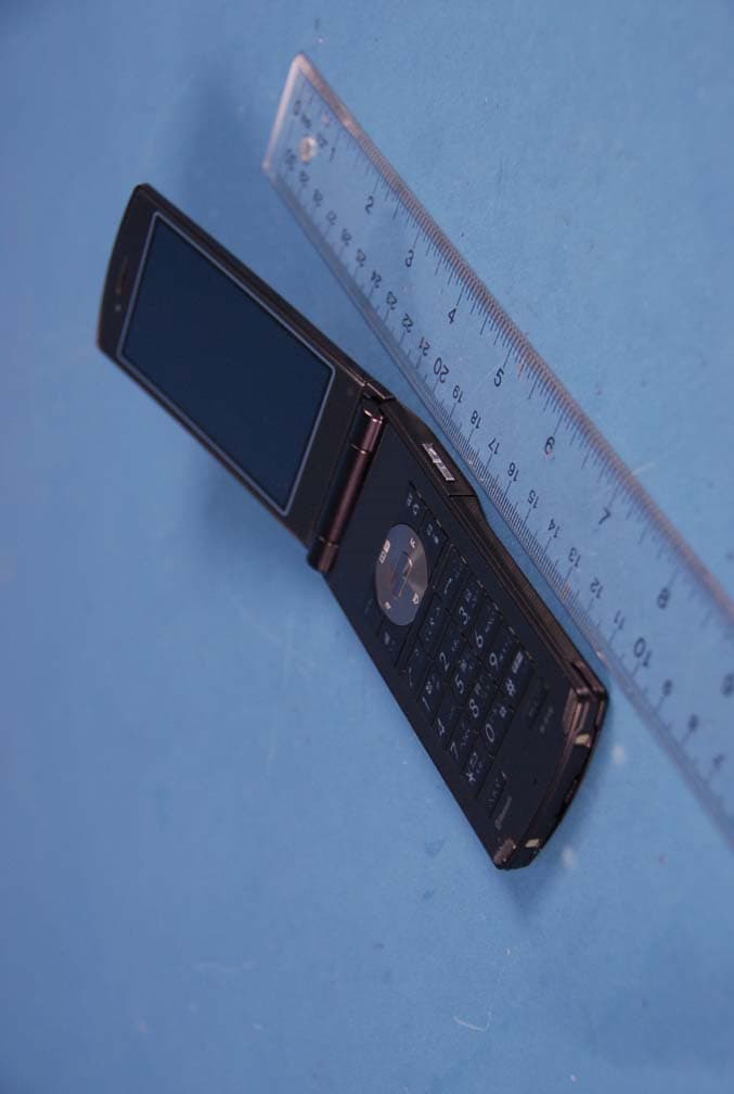 Cellular WCDMA and PCS GSM Phone with Bluetooth and RFID - FCC ID A98-HRG0037 - NEC Corporation of America