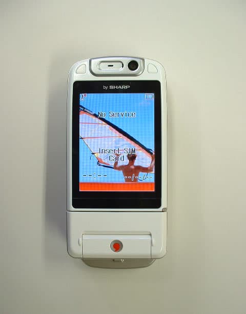 GSM Cellular Phone W/ Bluetooth - FCC ID APYHRO00038 - Sharp Corporation (1)