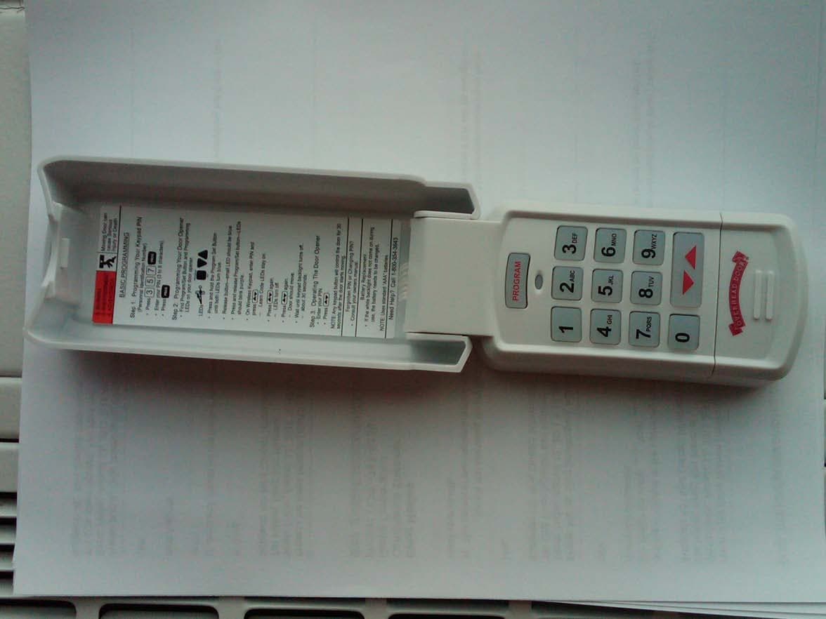 Wall mounted wireless remote control transmitter for operation of garage door opener - FCC ID B8Q315390KP - The Genie Company a Division of Overhead Door Corporation (3)