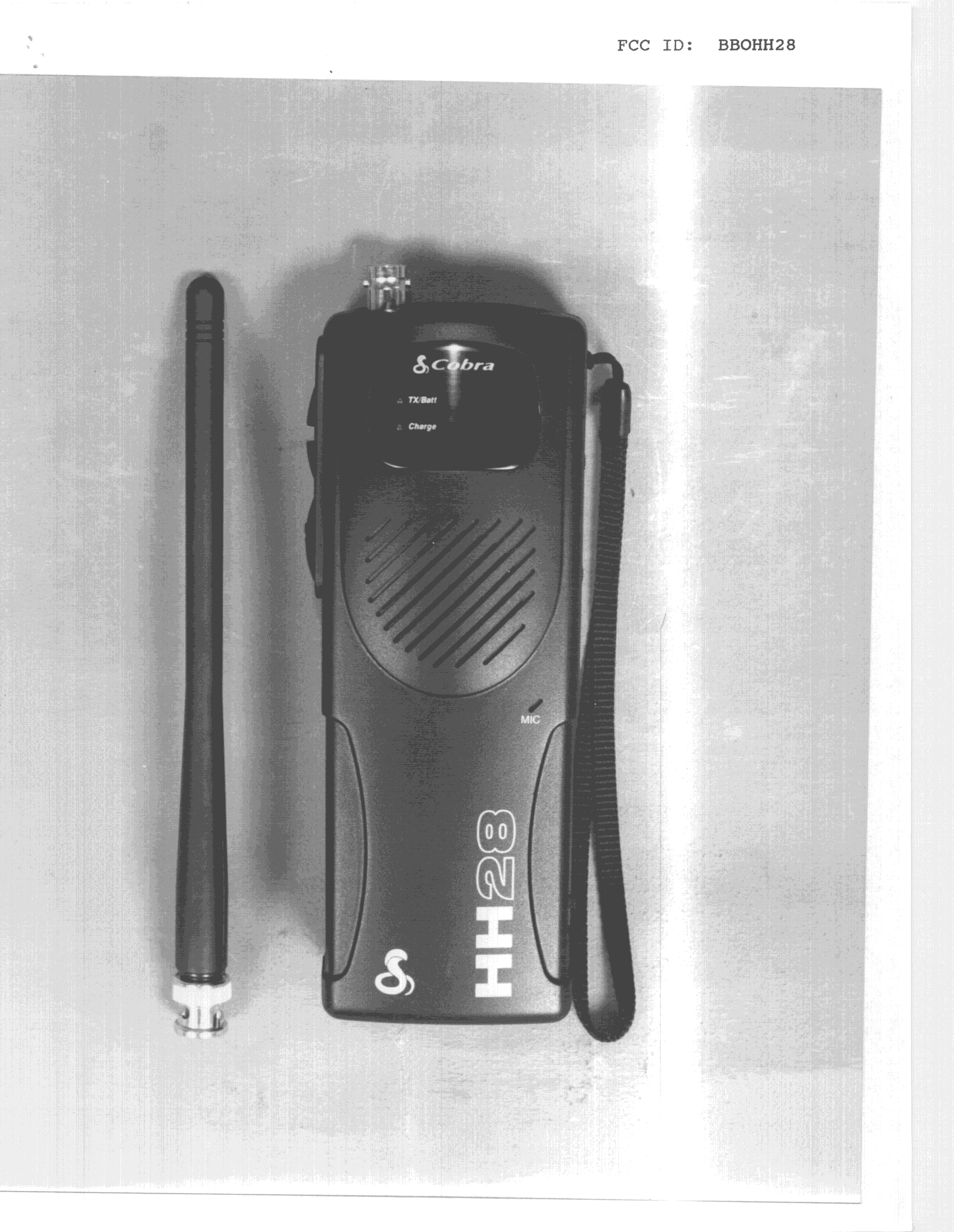 TNF - Licensed Non-Broadcast Transmitter Held to Face - FCC ID BBOHH28 - Cobra Electronics Corporation (1)