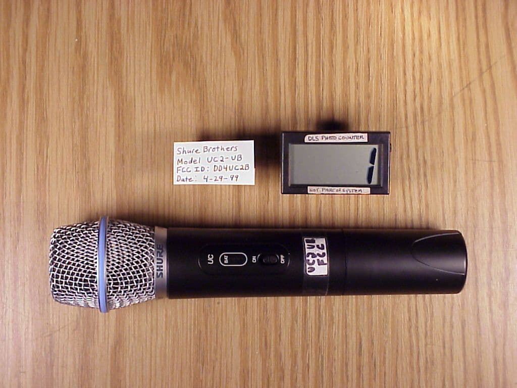 TNF - Licensed Non-Broadcast Transmitter Held to Face - FCC ID DD4UC2B - Shure Incorporated