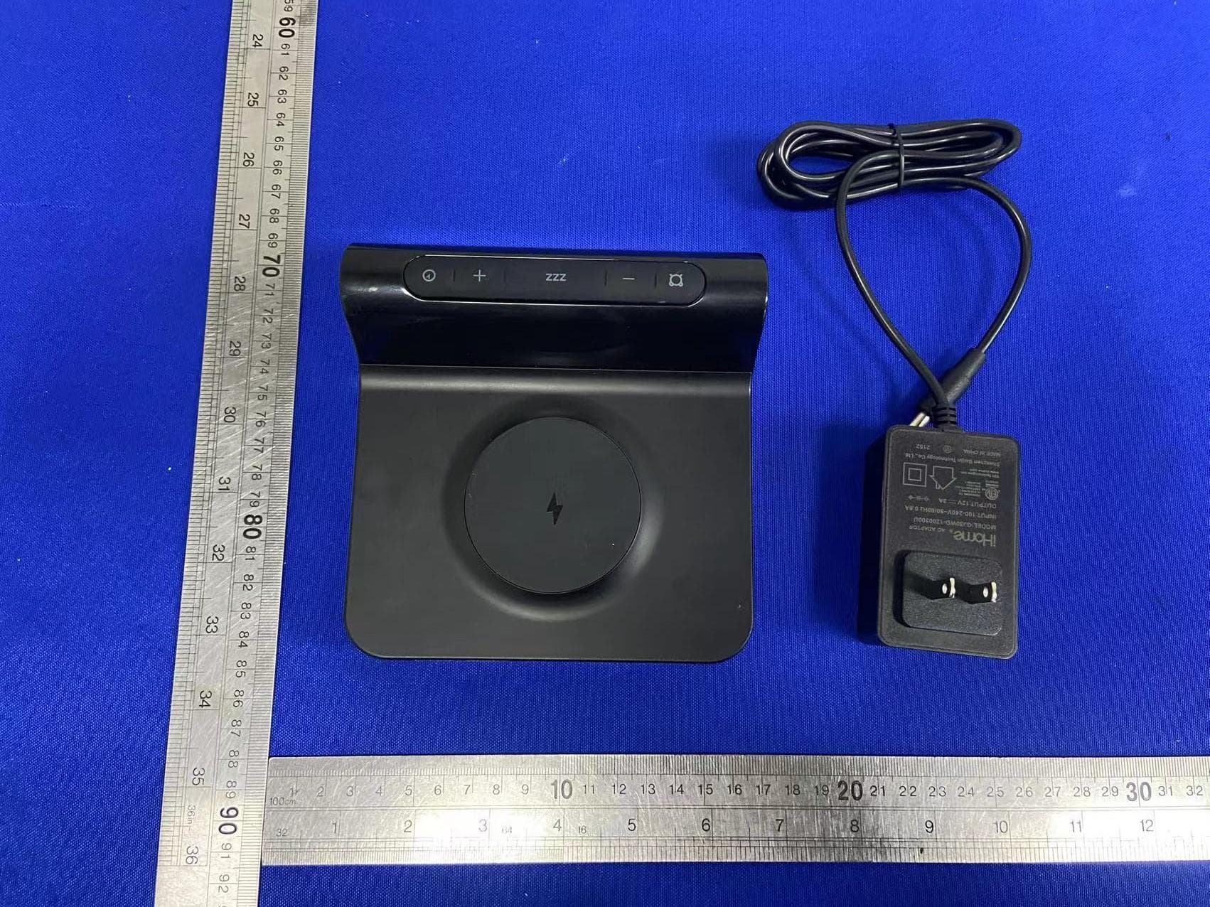 Compact Clock with Wireless Charging and Auto-Dimming Acrylic Display - FCC ID EMOIW23A - SDI Technologies Inc.