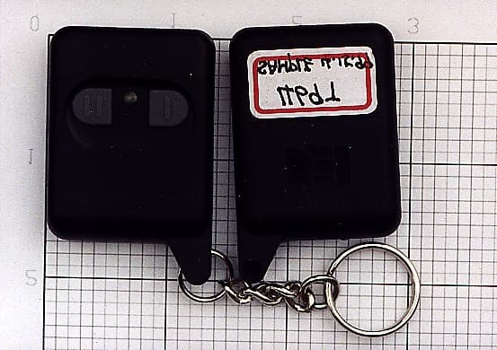 Two-button remote conrtol transmitter - FCC ID EZS469 - Voxx Electronics Corporation