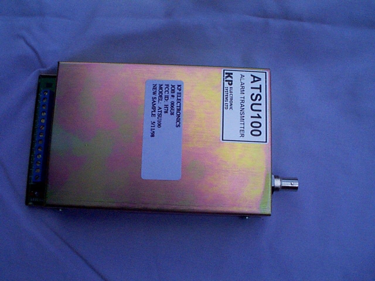 UHF RADIO SLARM TRANSMITTER - FCC ID H78ATSU100 - KP Electronic Systems Ltd