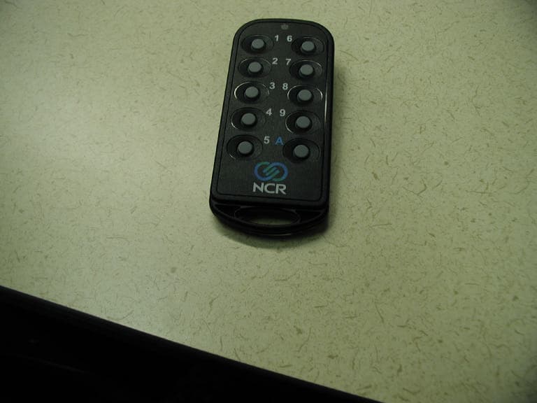 Remote Button Activator - FCC ID JEH7730K070 - NCR Corporation, RSD - Atlanta