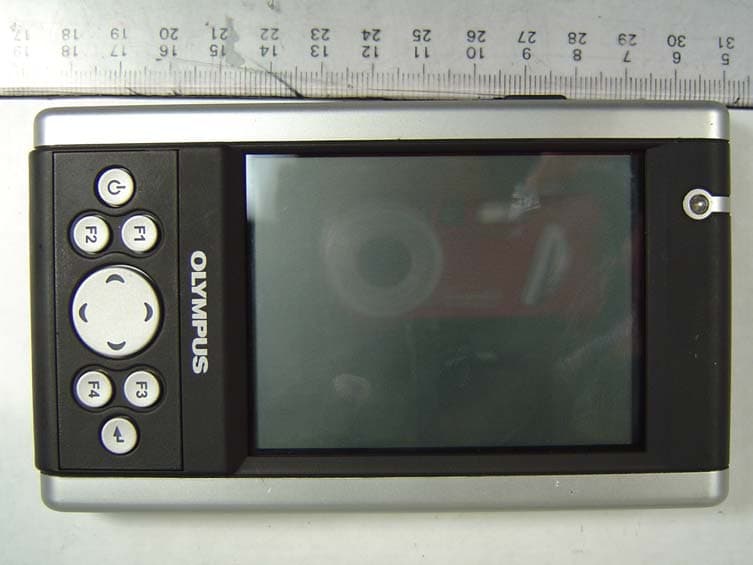 Handheld WinCE Device w/ Bluetooth & 802.11b WLAN - FCC ID RKS-R1018 - Olympus Technologies Singapore Pte Ltd (2)