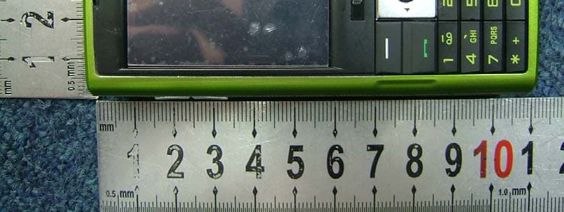 GSM TRIBAND GPRS MOBILE PHONE - FCC ID SV2OM1T1Q400 - Beyond Achieve Enterprises Ltd. (3)