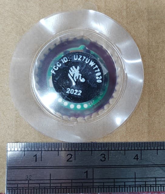 Small battery-operated UWB tag transmitting 2.5nsec UWB pulses at 7.55GHz with a magnetic receive interface at 125KHz used for provisioning. - FCC ID UZ7UWT7020 - Zebra Technologies Corporation