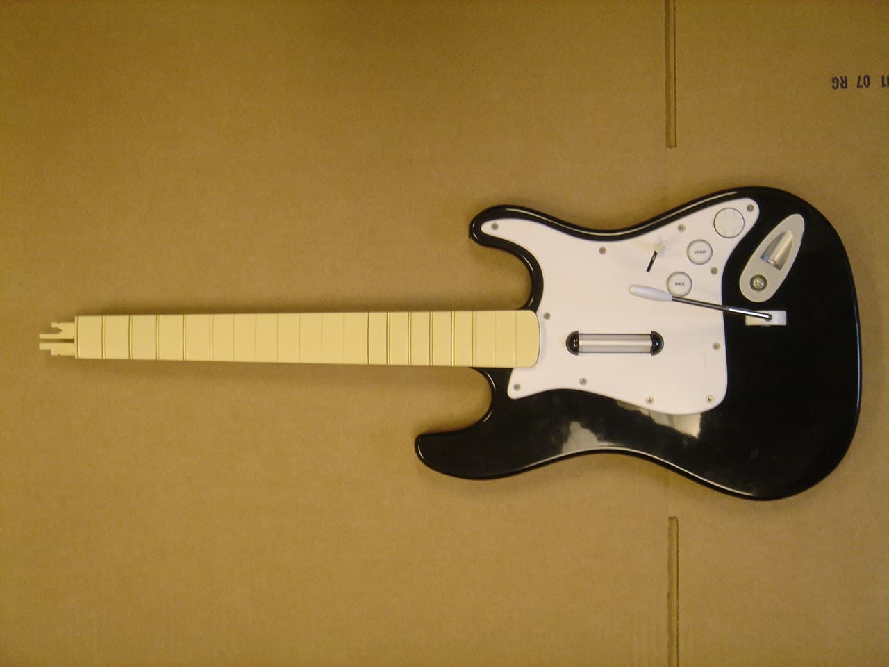 Wireless Guitar Controller for XBox360 - FCC ID VFRHMXGTR01 - Harmonix Music Systems, Inc.