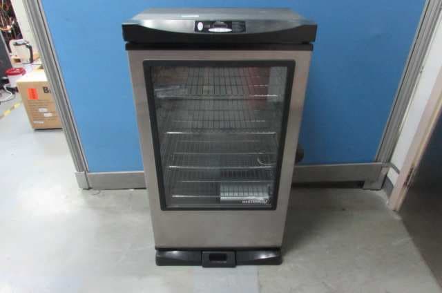 Black Electric Smoker - FCC ID YHXESQ-3040C6 - Masterbuilt Manufacturing, LLC.