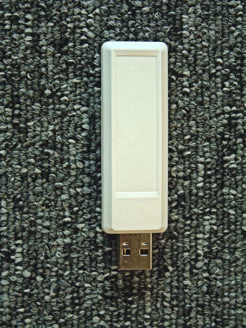915 MHz USB Dongle - FCC ID ZT9-TZ207021V2 - Toumaz Microsystems Ltd. (1)