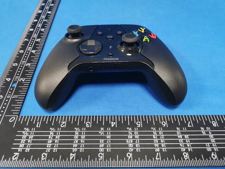 Wireless Accessory Controller - FCC ID 2A9QT-RMTWL001 - liaochengchengxinpingmianshejiyouxiangongsi