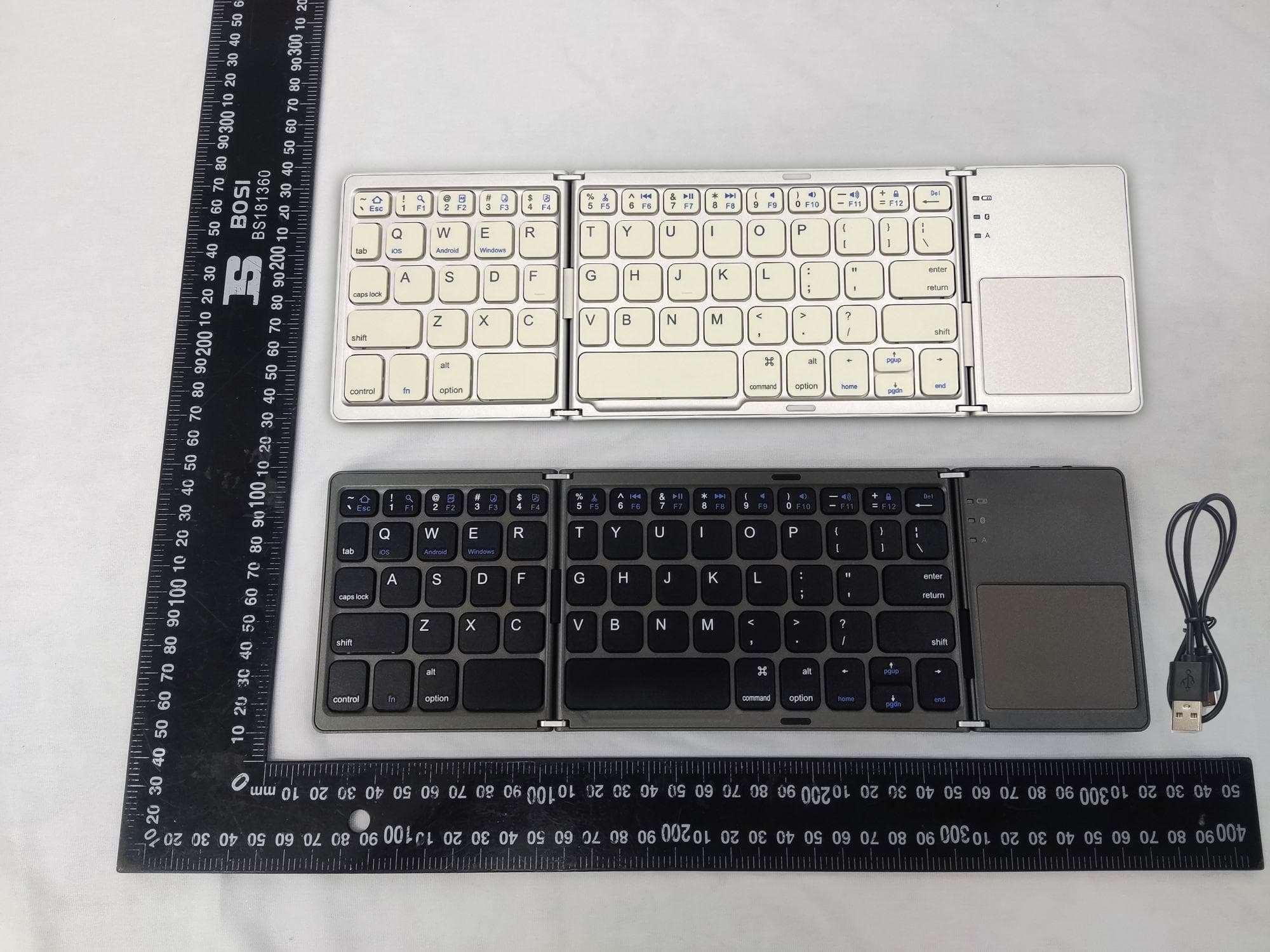 Folding Bluetooth keyboard with touchpad - FCC ID 2BLHY-B033 - Huazhoushiguannanshangmao Co., Ltd.