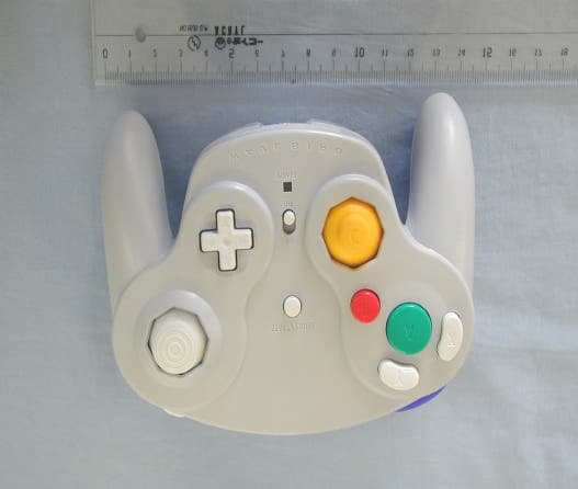 Wireless Game Controller - FCC ID EW4DOLAW - Mitsumi Electric Co Ltd