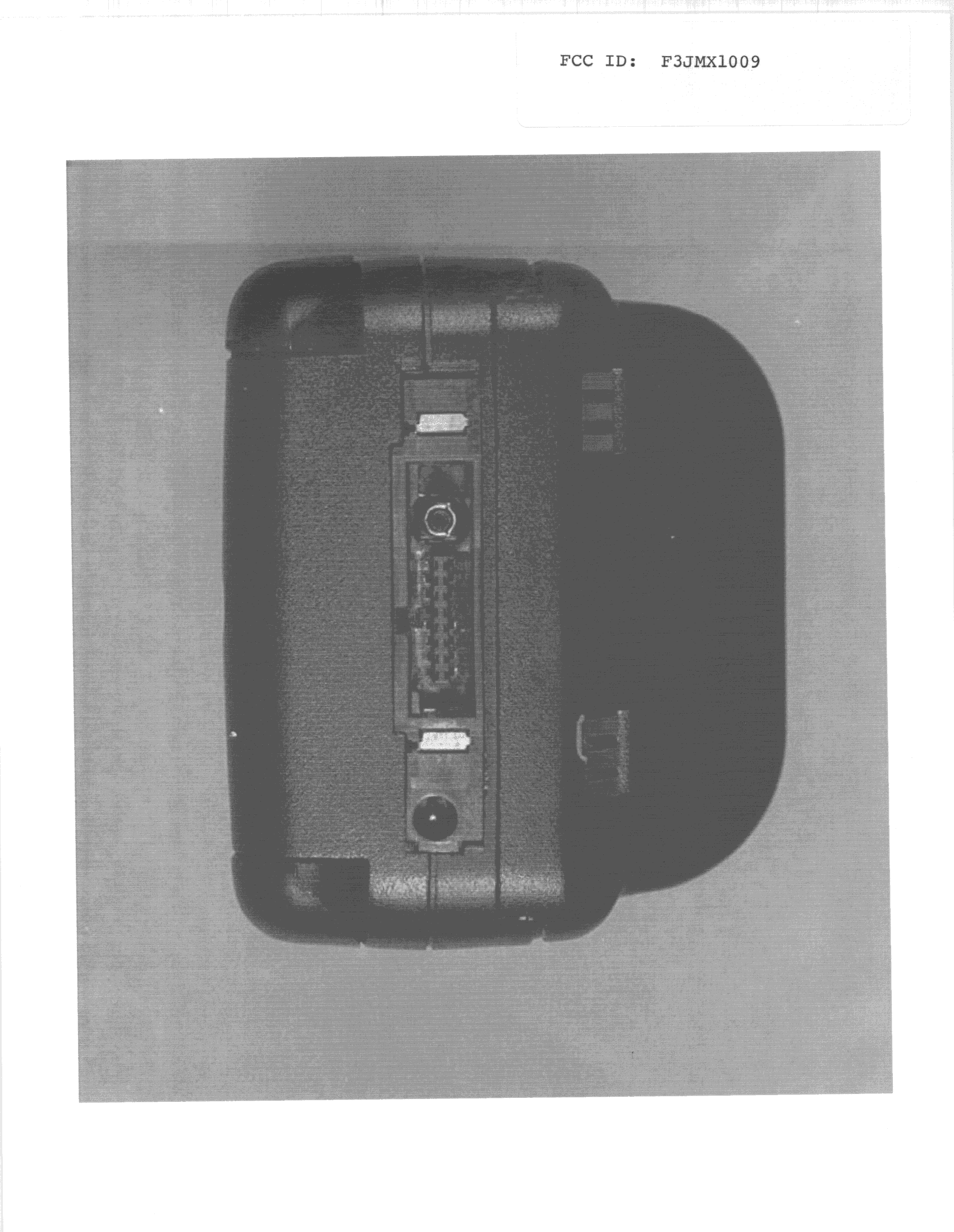 TNE - Licensed Non-Broadcast Transmitter Held to Ear - FCC ID F3JMX1009 - Midland Radio Corporation