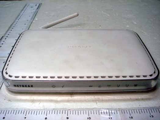 Integrated ADSL Modem + Wireless Router with Voice - FCC ID PY305400024 - Netgear Incorporated
