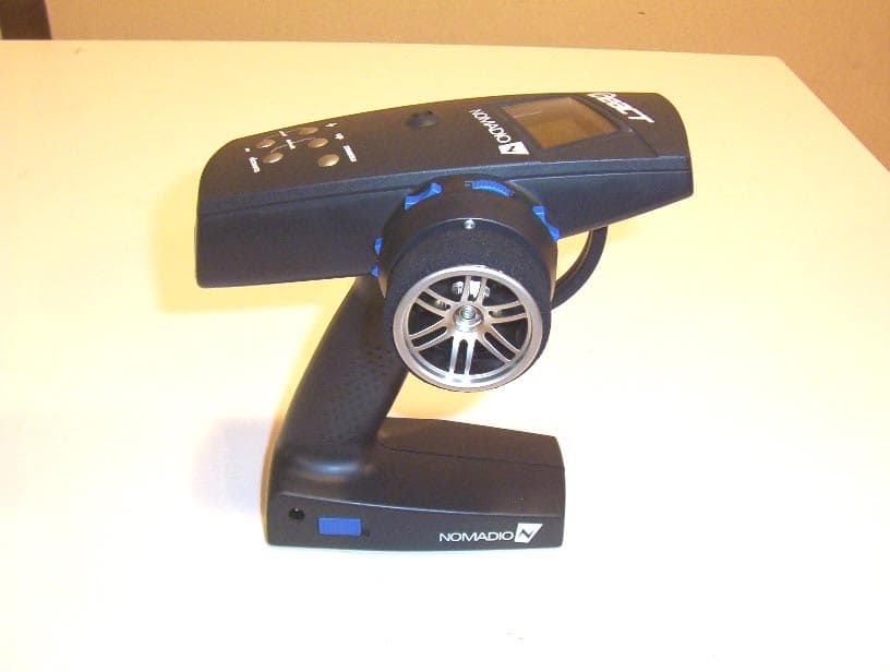 Hand Held Remote - FCC ID TSDNMD-AM07 - Nomadio, Inc.